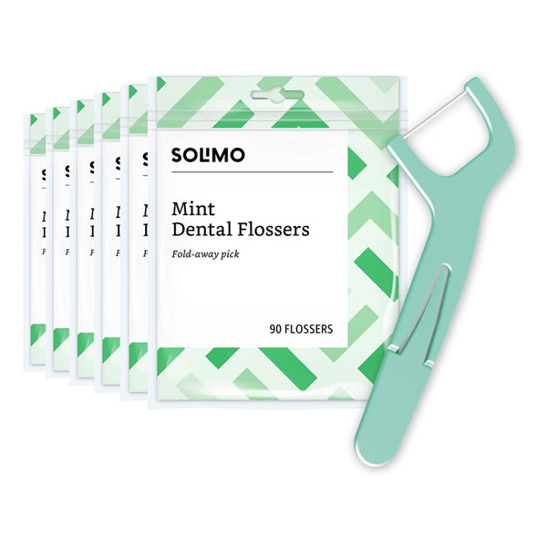 Six packs of Solimo Mint Dental Flossers, 90 flossers each (540 count total), are displayed with a single green flosser. From Solimo, these shred-resistant flossers help fight plaque for a cleaner, fresher mouth.